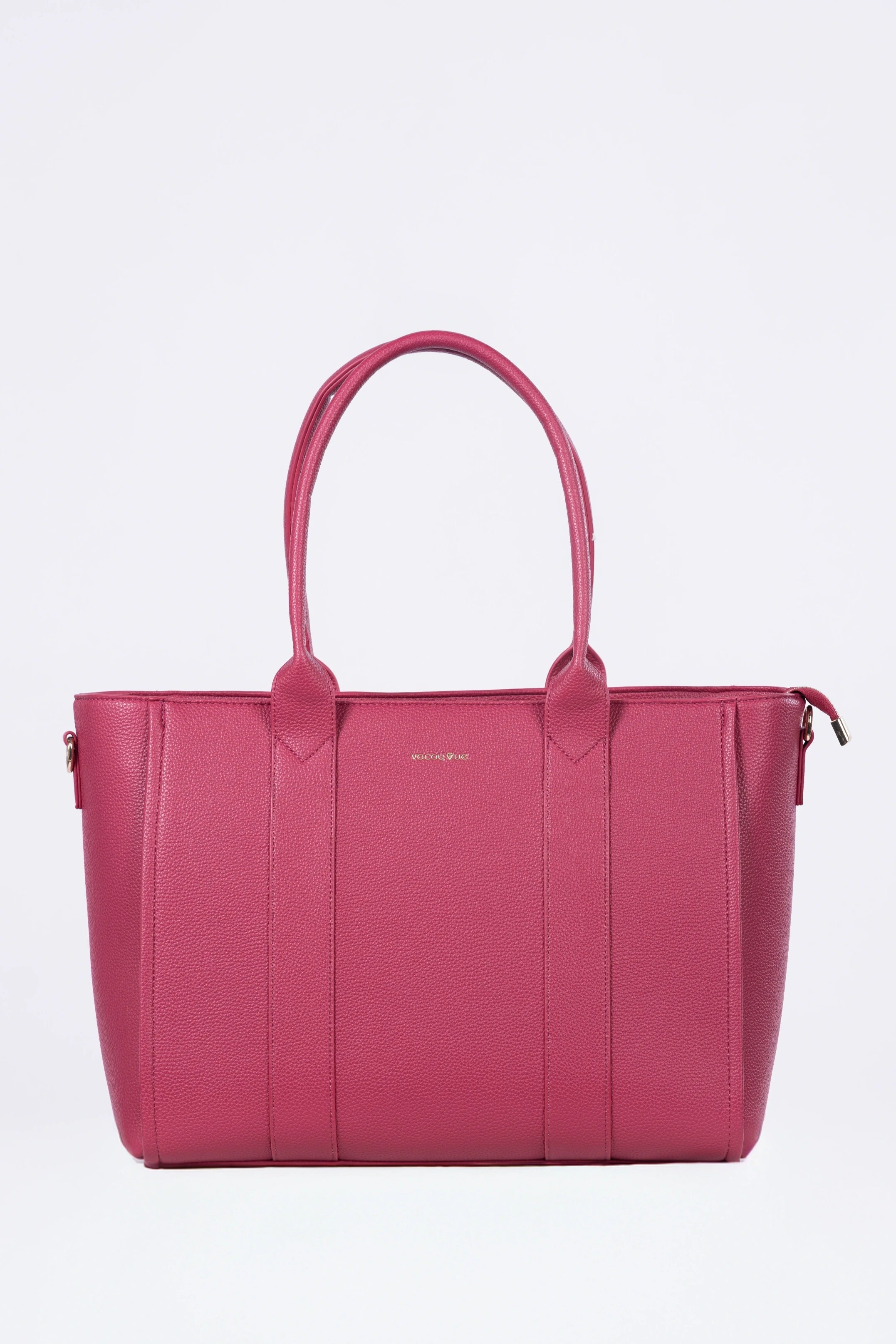 Pink handbag on a light purple background