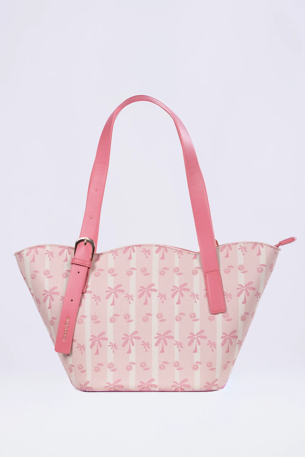 Pink handbag with floral pattern on a light purple background