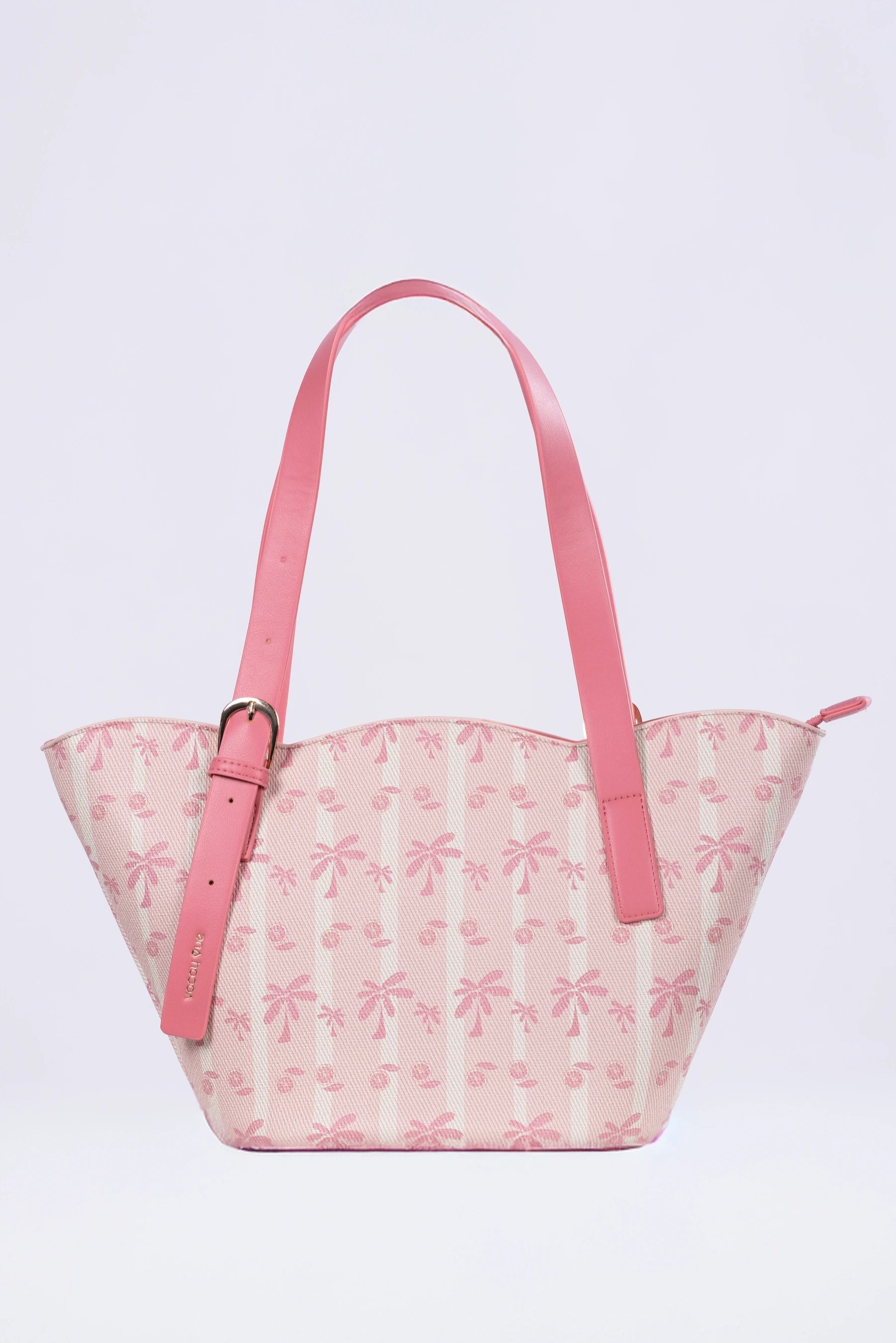 Pink handbag with floral pattern on a light purple background
