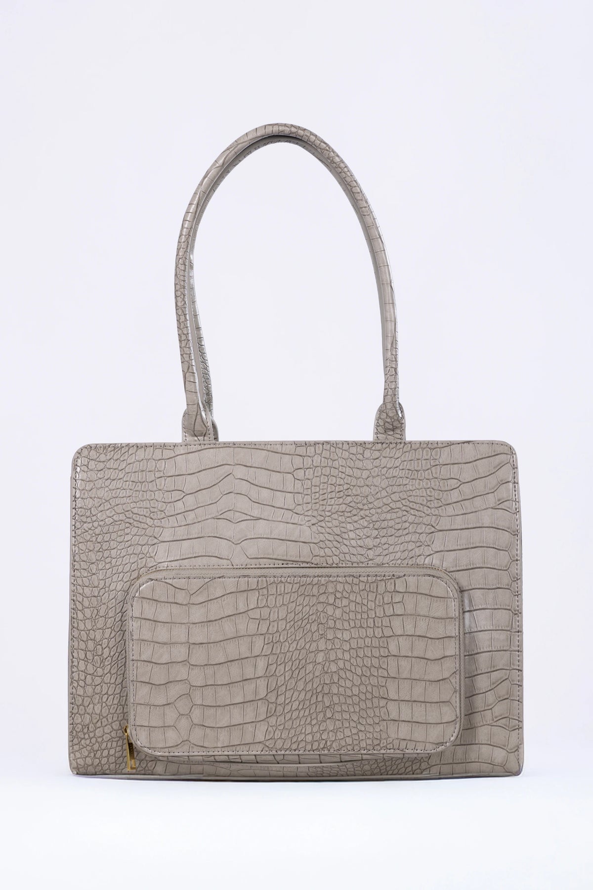 Beige handbag with crocodile texture on a white background