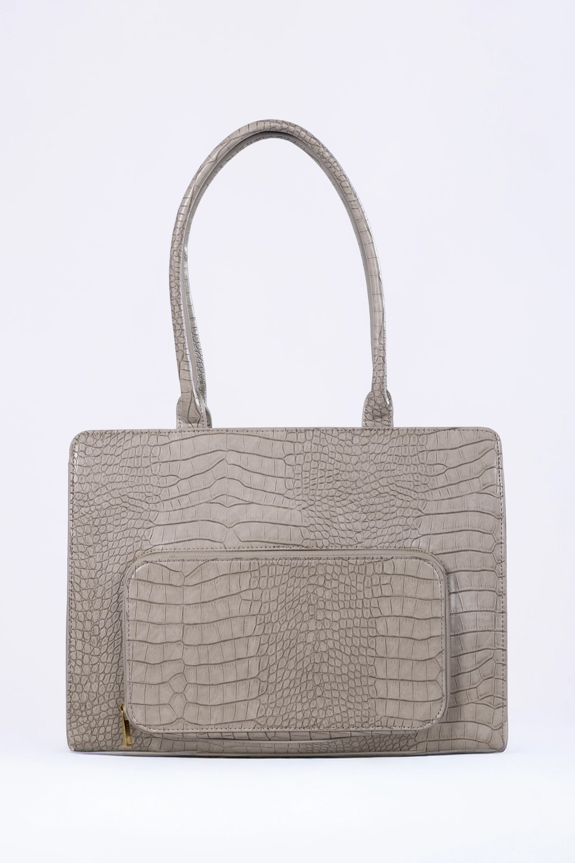 Beige handbag with crocodile texture on a white background