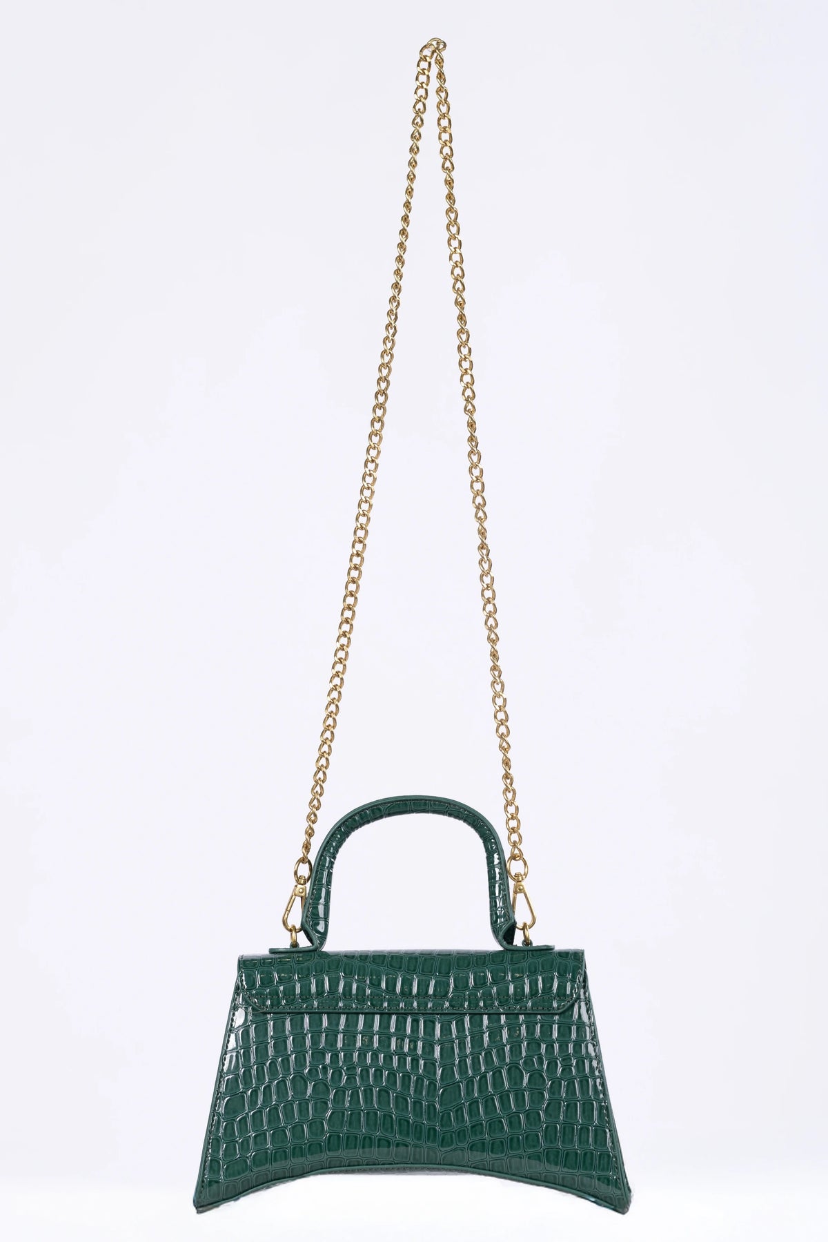 Green handbag with a gold chain on a light gray background
