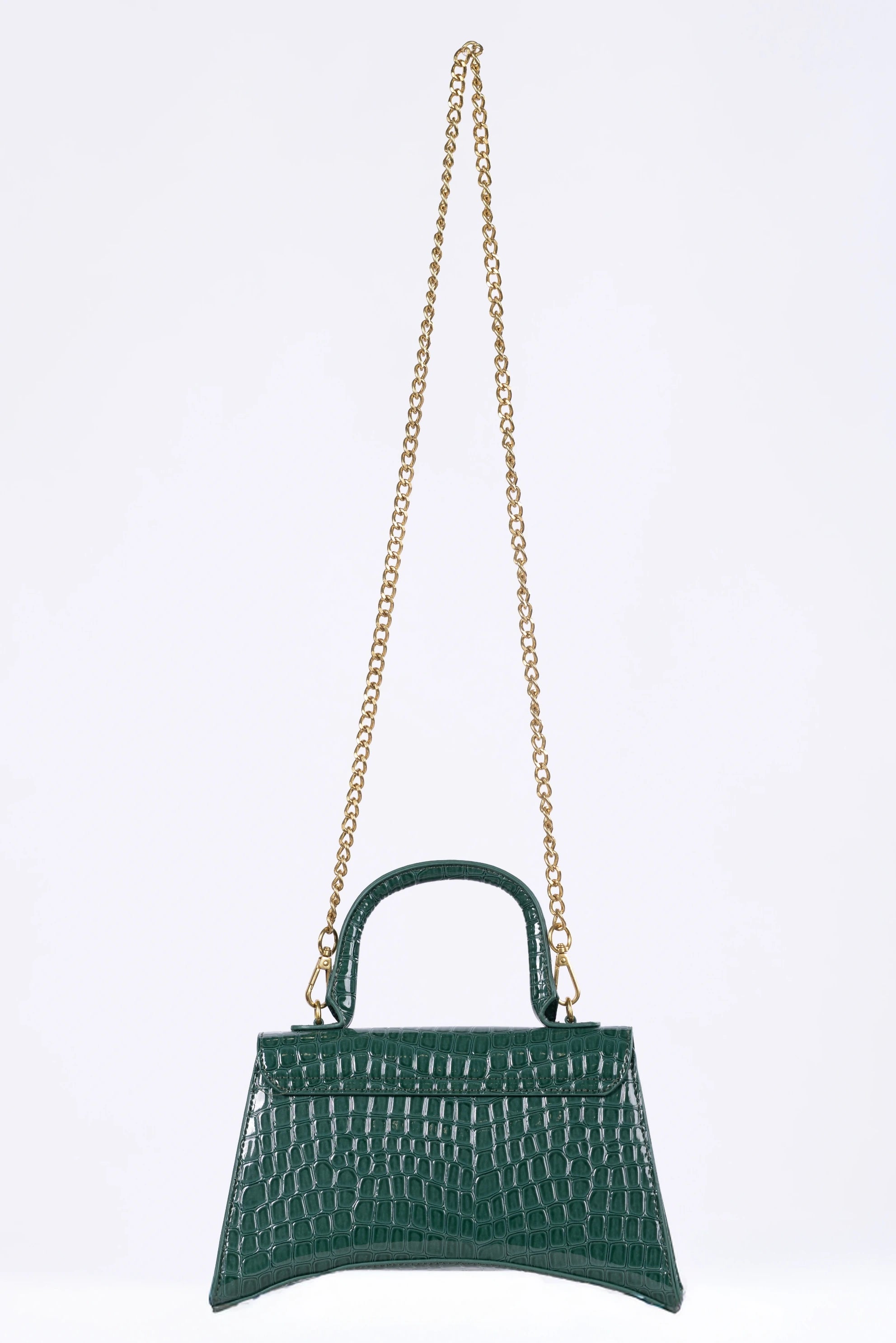Green handbag with a gold chain on a light gray background