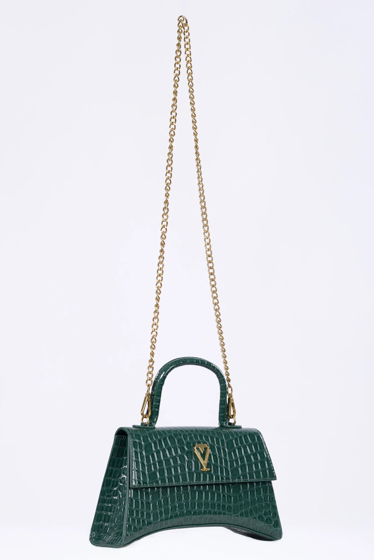 Green handbag with a gold chain on a white background