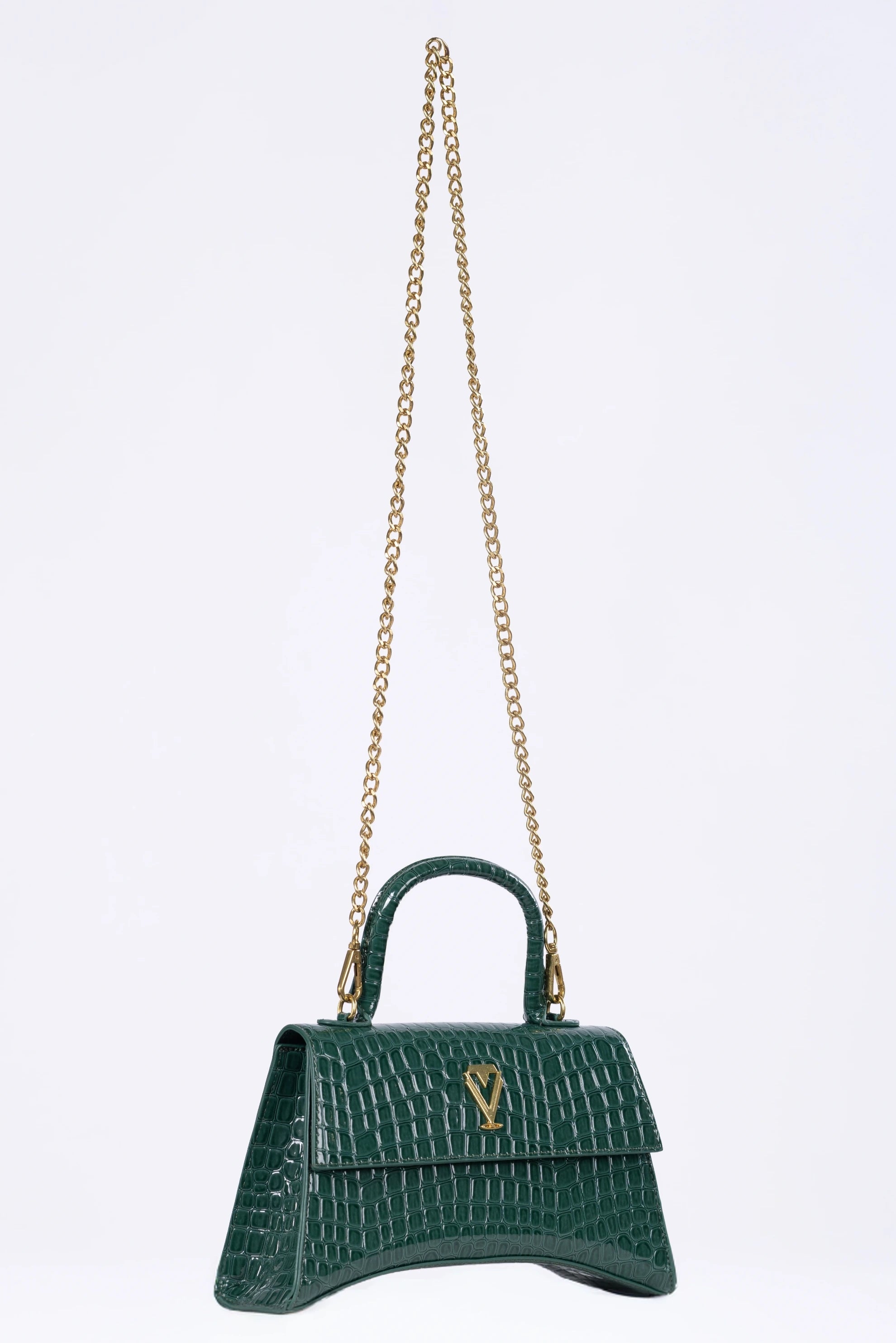 Green handbag with a gold chain on a white background