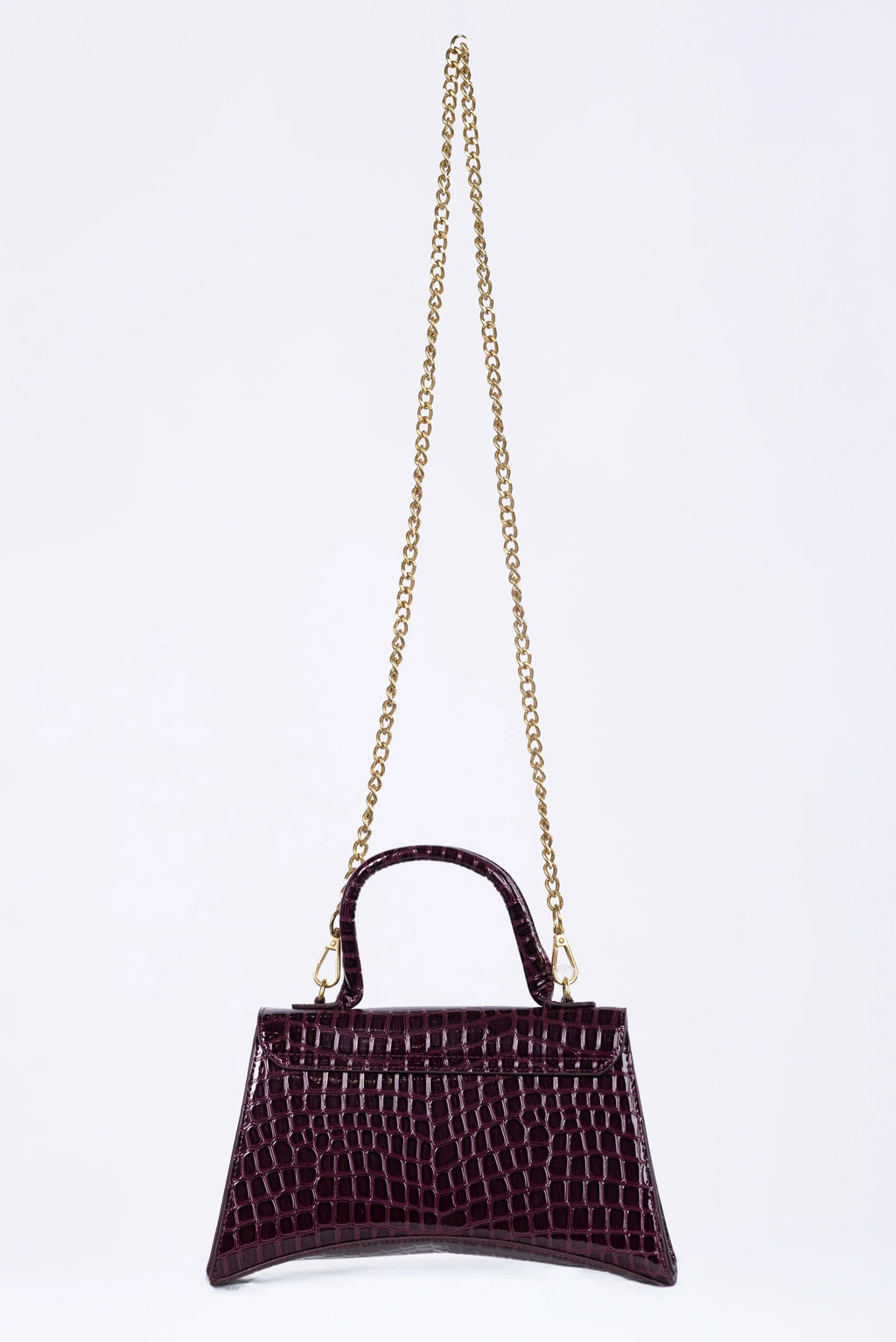 Purple handbag with a gold chain on a white background