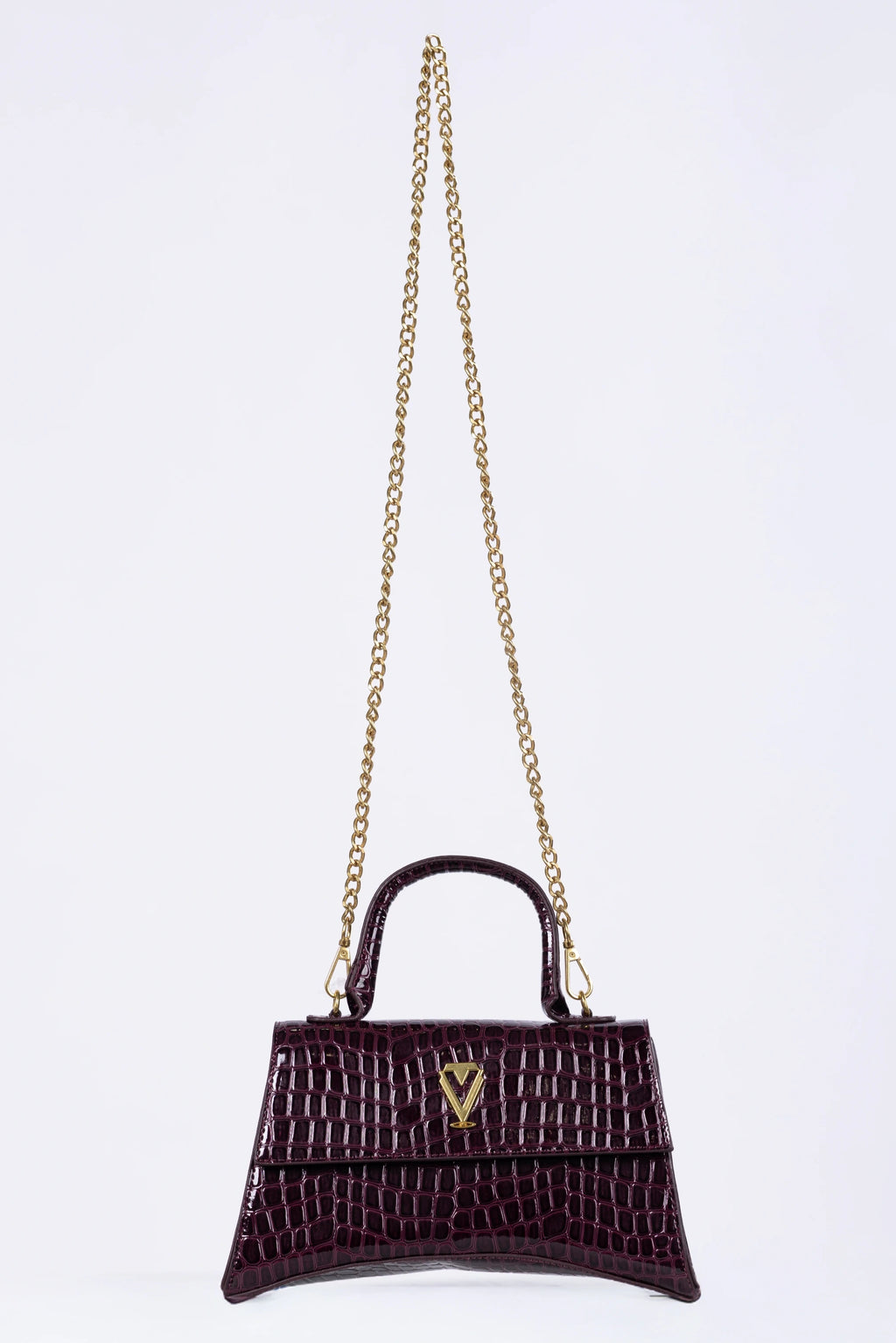 Purple handbag with gold chain on a white background