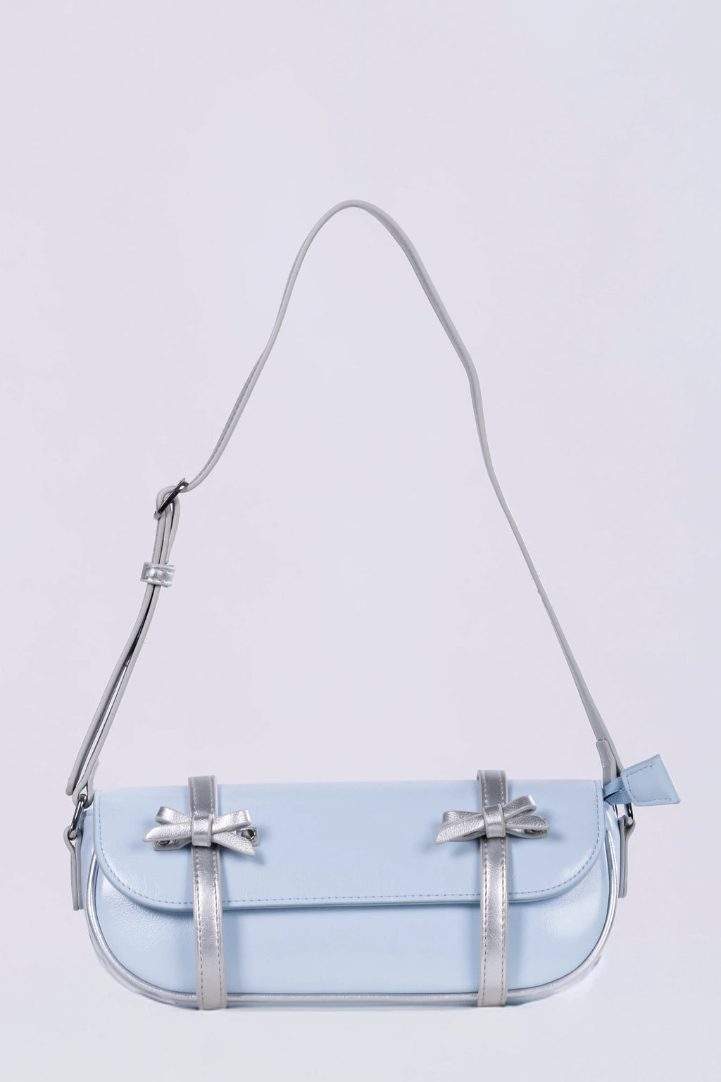 Clear handbag with a strap on a light purple background