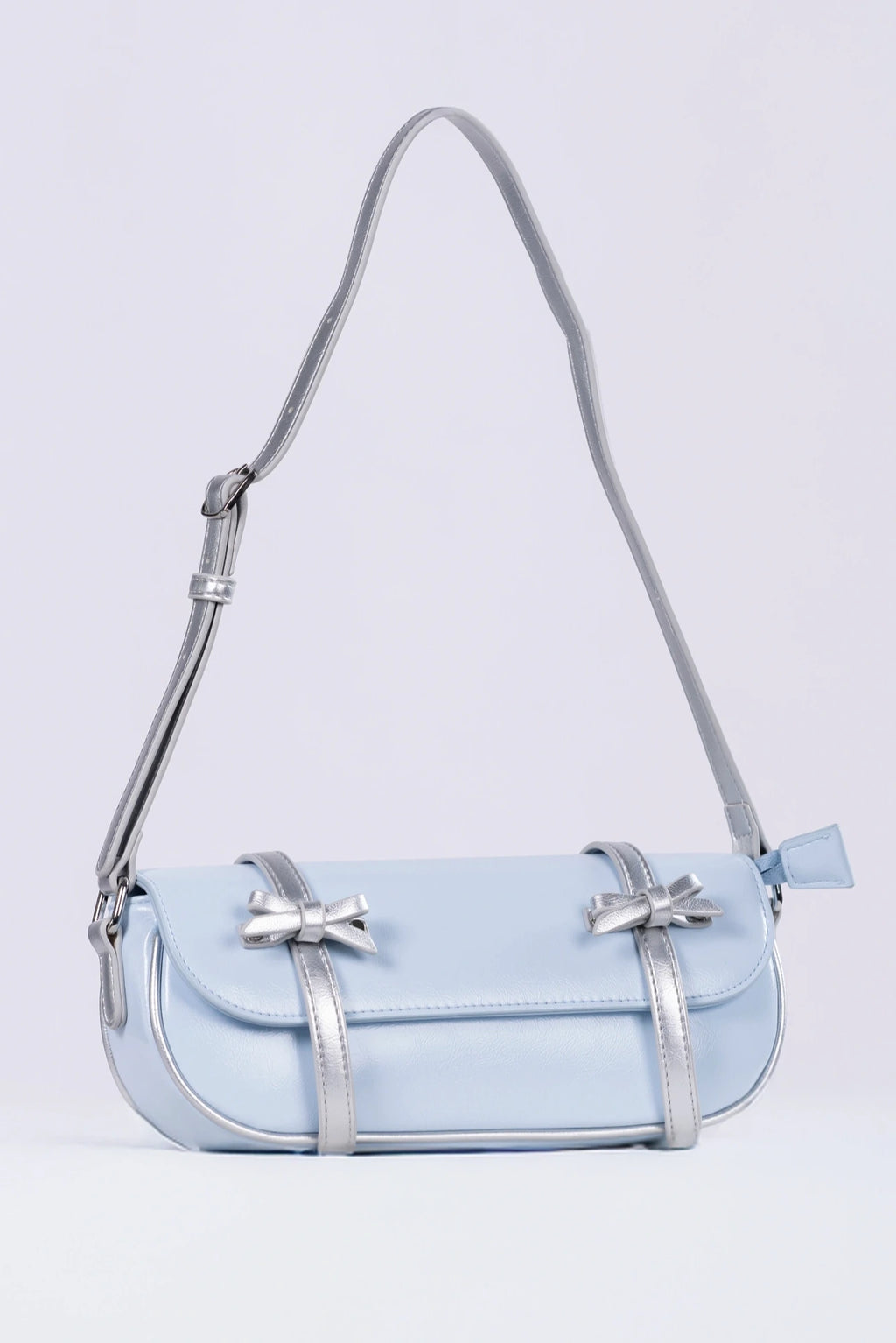 Light blue handbag with a strap on a light gray background